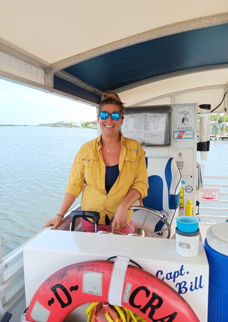 A woman sitting on the back of a boat.